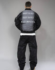 Varsity jacket "TRUST" con ricamo